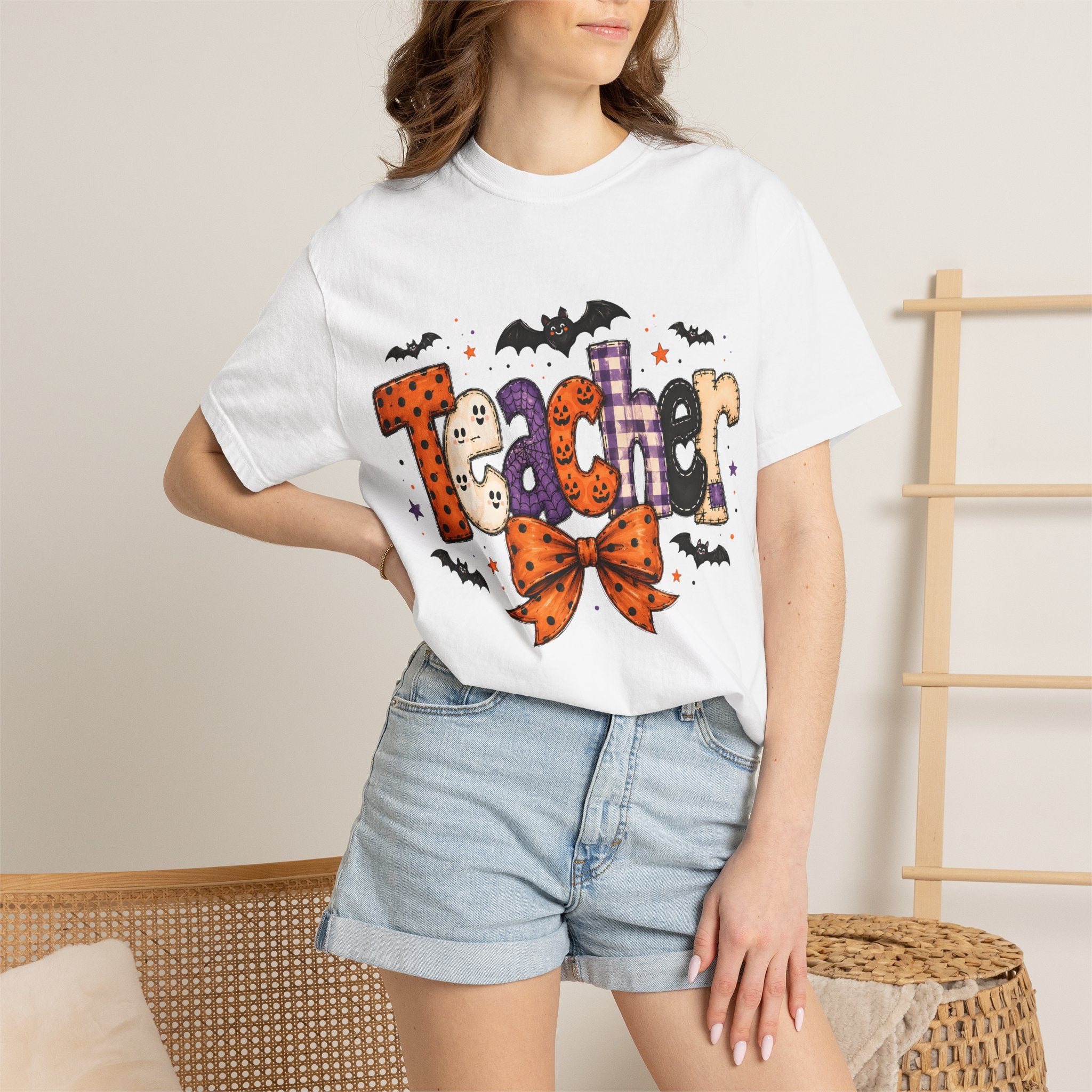Teacher Halloween T-Shirt — Cute Spooky 'Teacher' Design with Bats & Bow. Midnight Eye, LLC
