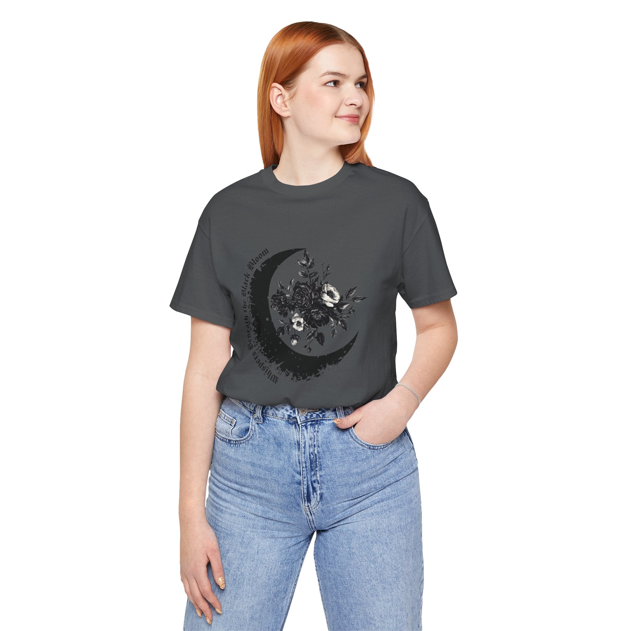Person wearing a dark gray t-shirt with a moon design on a white background
