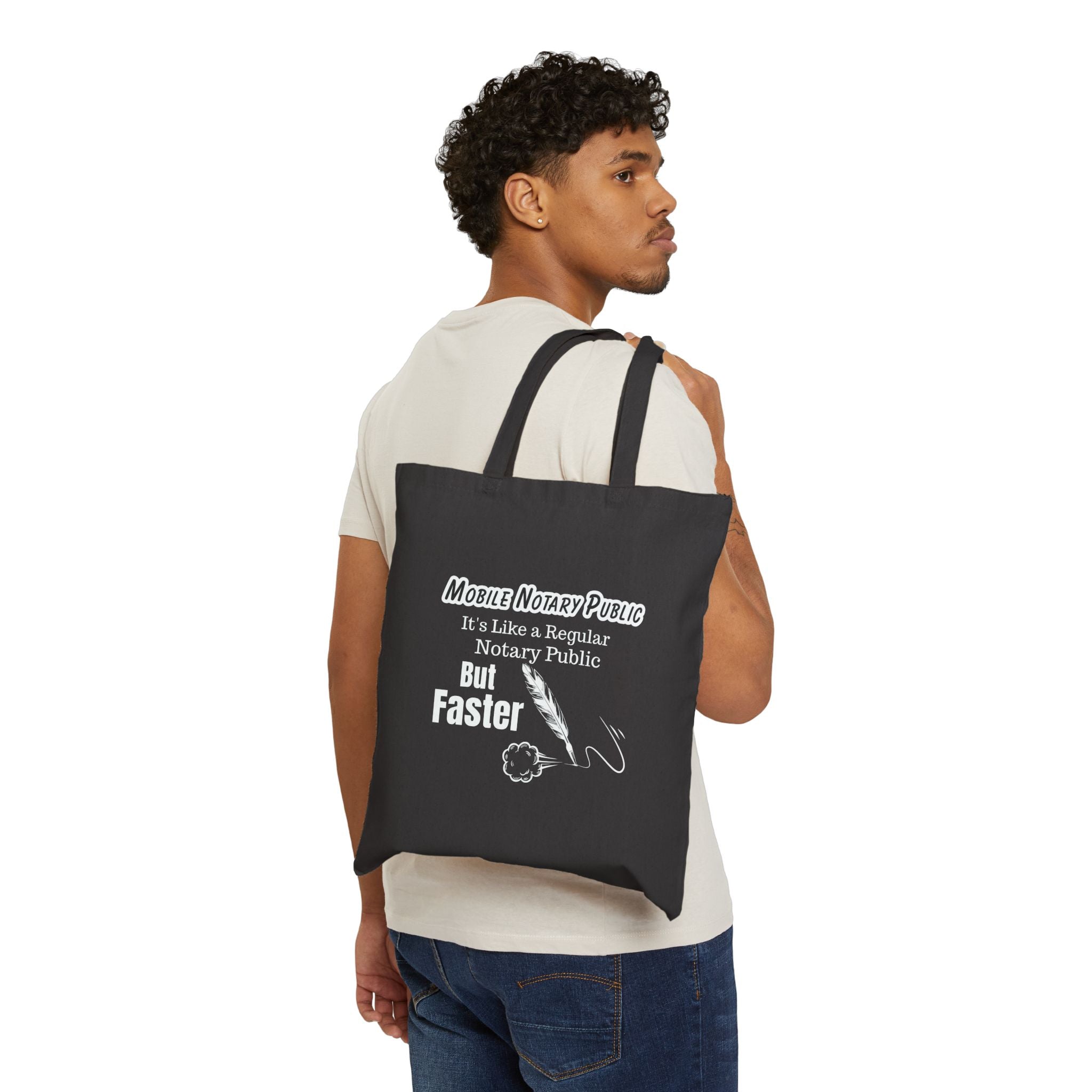 Man carrying a black tote bag with colorful text design on a white background