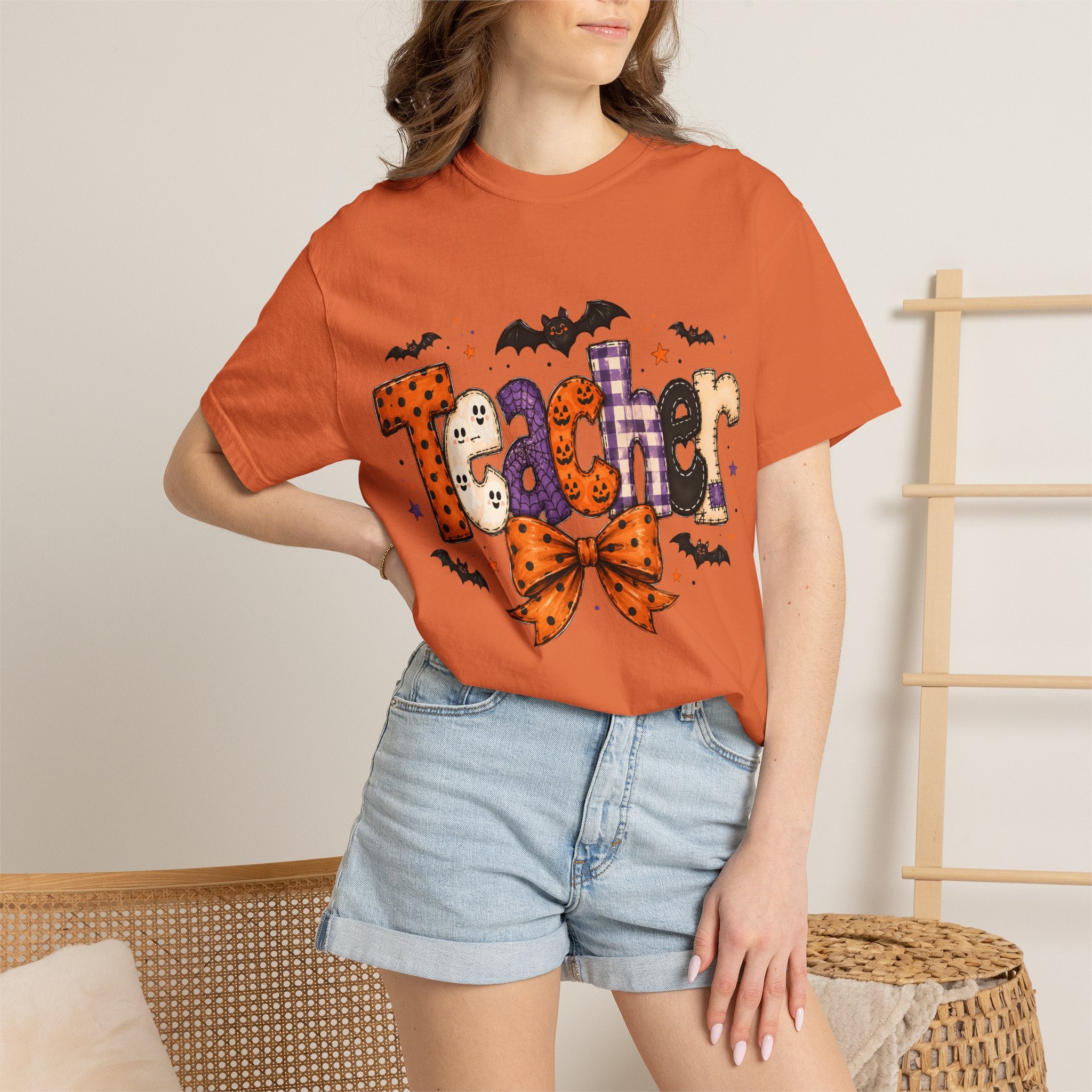 Teacher Halloween T-Shirt — Cute Spooky 'Teacher' Design with Bats & Bow. Midnight Eye, LLC