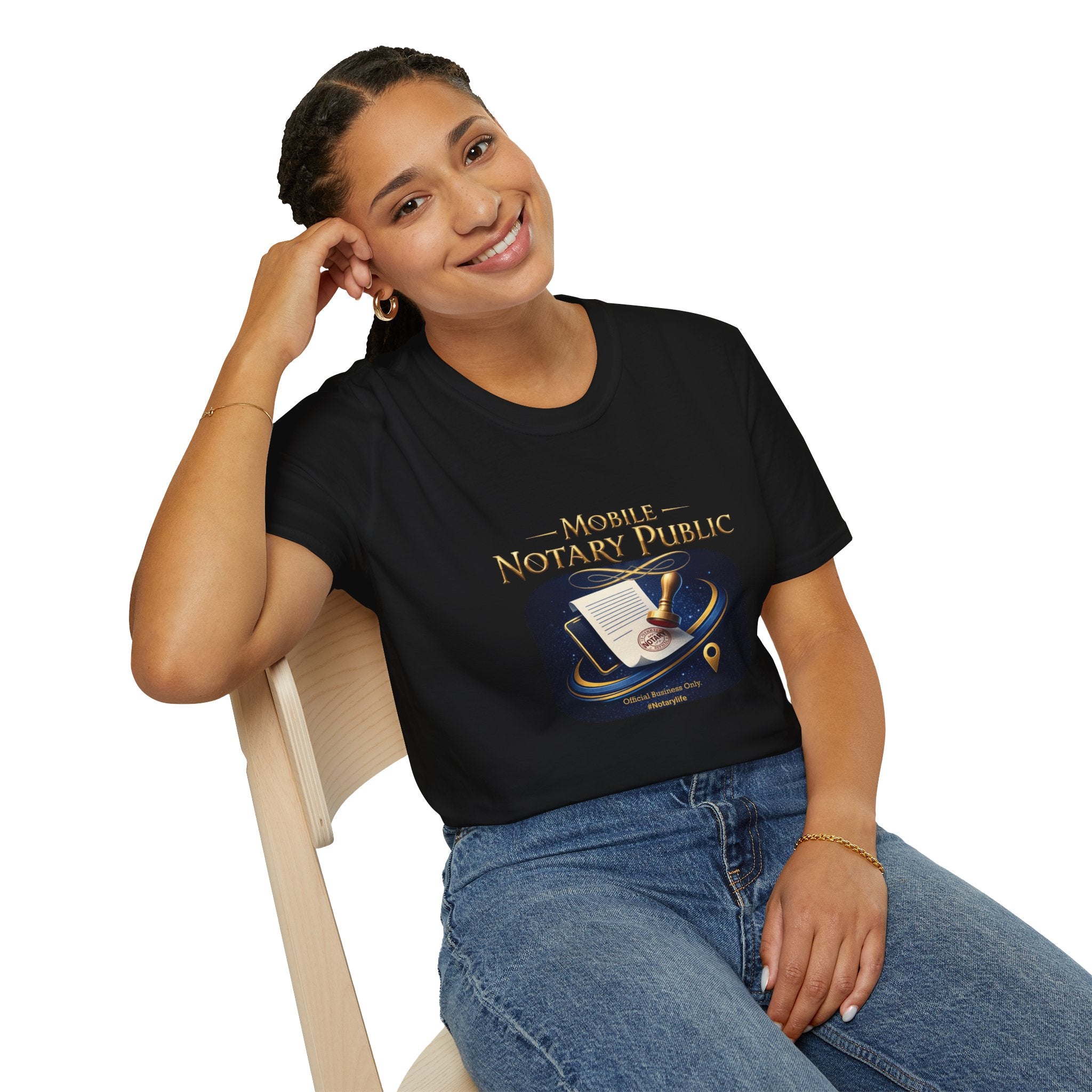 Woman wearing a black t-shirt with 'Mobile Notary Public' design, sitting on a chair.